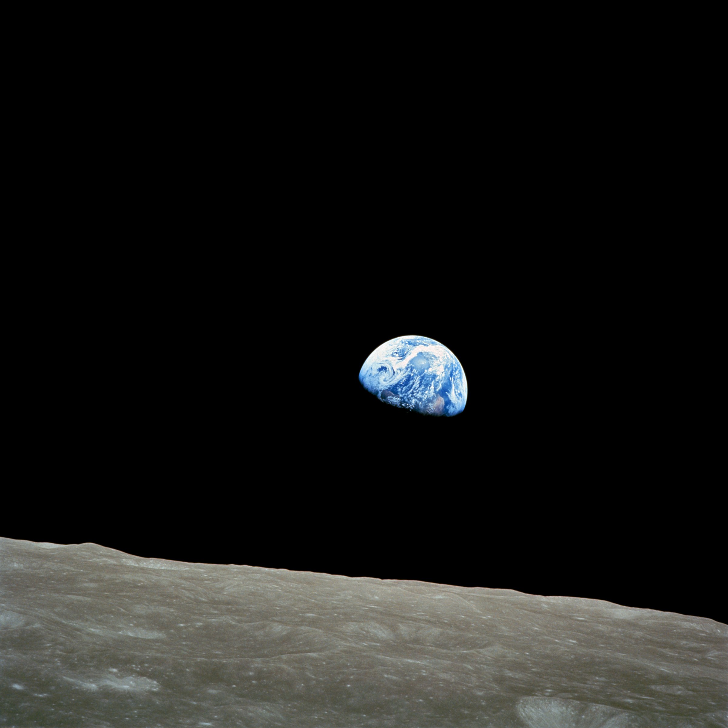 Earthrise — Earth rising over the lunar surface